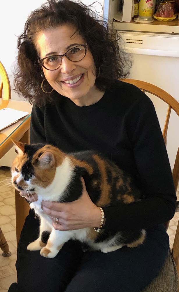 Lesléa holds her calico cat